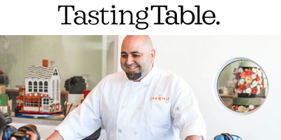 Chef with goatee smiling, tasting table above his image