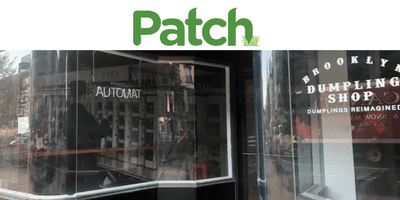 Patch in green font of storefront with large windows
